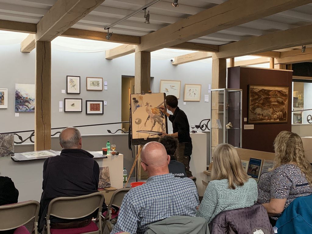 Image: Darren Woodhead at work, painting a turtle dove in watercolour. Credit: Jos Ashpole.