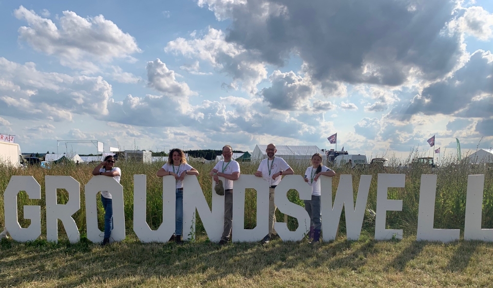 Operation Turtle Dove team standing next to large Groundswell sign.